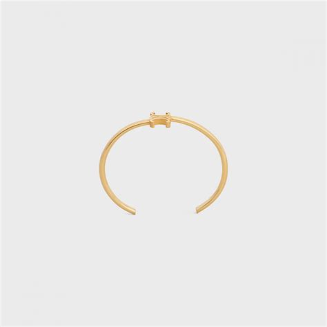 Women's Triomphe asymmetric in brass cuff with gold finish